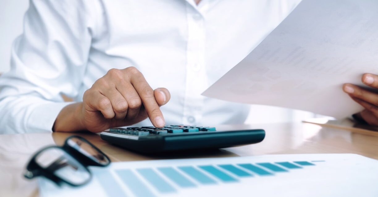 finances-saving-economy-concept-female-accountant-banker-use-calculator-min